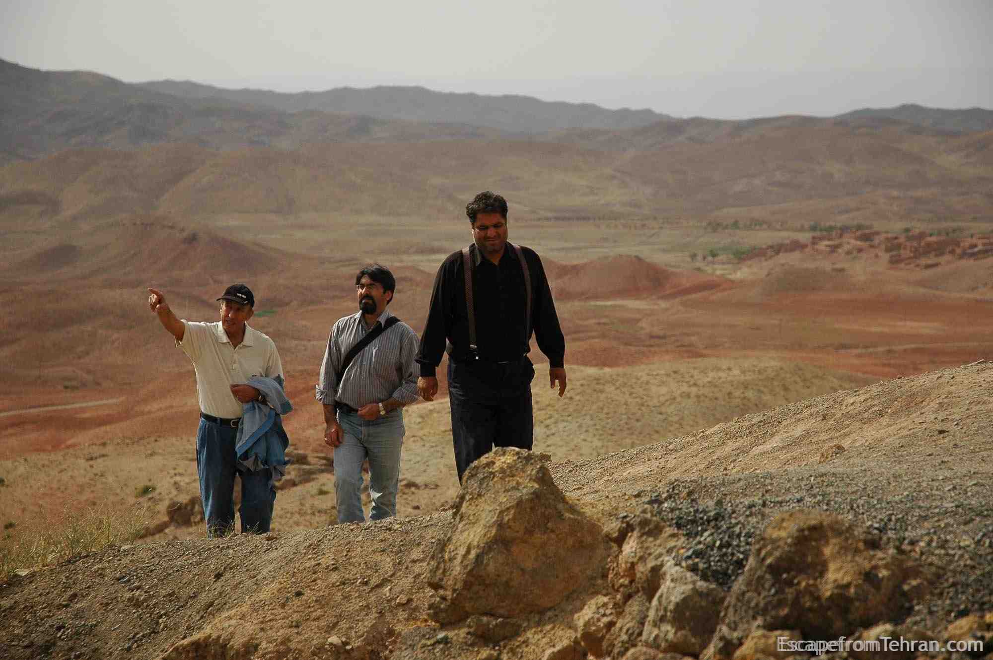 Iranian Men climbing toward Baba langar historical sites, near sabzevar, iran